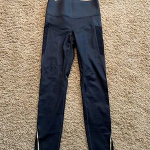 Under Armour black tight with gold. Size small